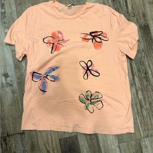Peach Graphic T-Shirt with Abstract Floral Design